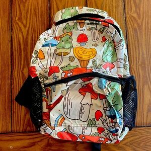 a brand new never used frog and mushroom back pack